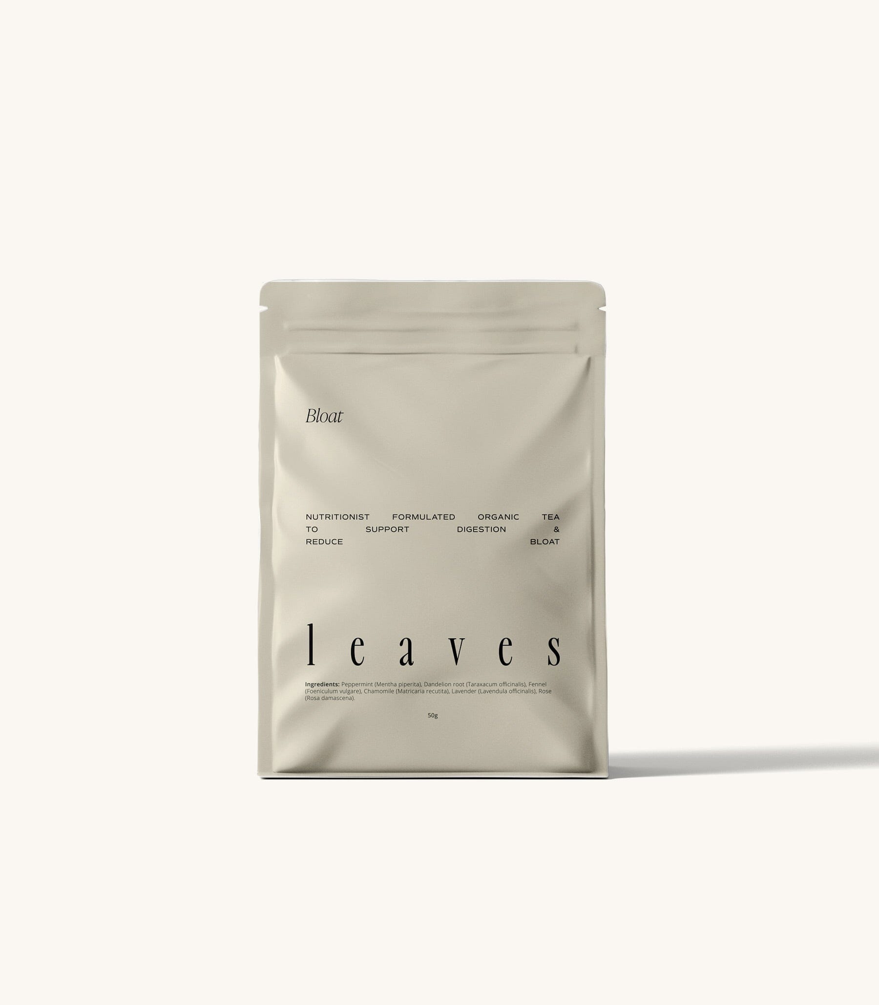 Bloat tea pouch standing on a cream background 